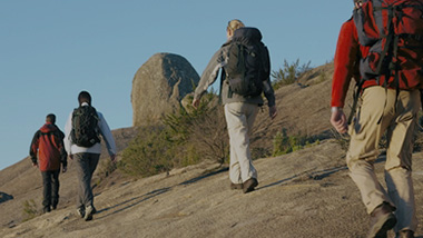 Group of people walking using senior dating services